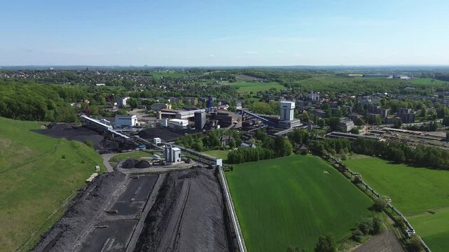 polish coal mine view of the mining shaft, the mine wheel turning, the coal plant view from the drone