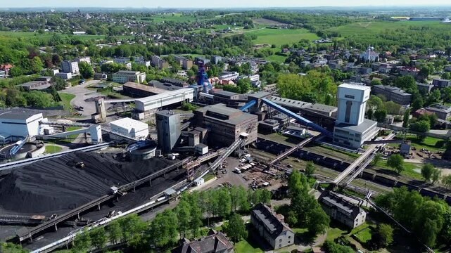polish coal mine view of the mining shaft, the mine wheel turning, the coal plant view from the drone