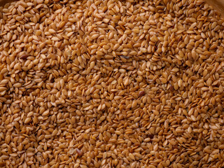 Organic golden flaxseed, linseed grains. Superfood high in fiber.