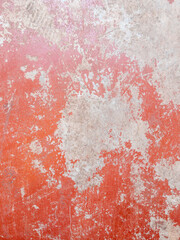 Weathered Red Wall with Exposed Concrete.