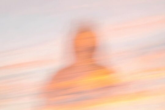 Blurred Figure Against Sunset