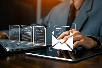 E-Invoice and Digital billing concept, Businessman using laptop to manage electronic statements on virtual screen. E-tax, Digital receipt, Online invoice processing and tax accounting solutions.