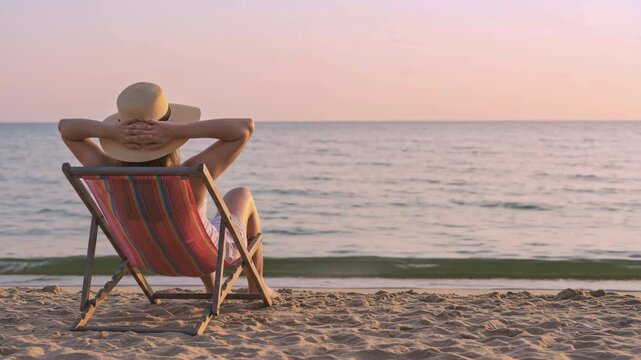 Relaxing beachside retreat individual at sunset on sandy shore lifestyle photograph calm ocean environment inspirational perspective