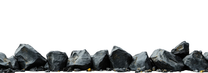 A close-up view of a line of rugged. dark rocks arranged on a surface. showcasing their texture and natural beauty. with a blurred green background hinting at a lush environment