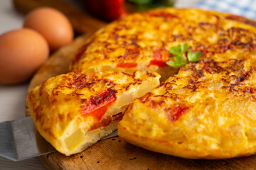 Traditional Spanish omelet with potato, egg, and red pepper. A traditional Spanish tapas recipe.