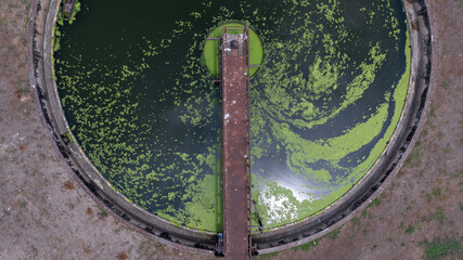 Aerial view westewater treatment tank with wastewater, Circle circular water clarifier cleaning water, Circle water treatment plant circular clarifier, Water treatment plant.