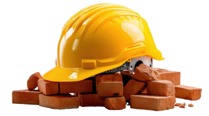Construction Site Essentials: A yellow hard hat rests atop a pile of sturdy bricks, symbolizing the foundation of construction and building and the importance of safety measures in any project.