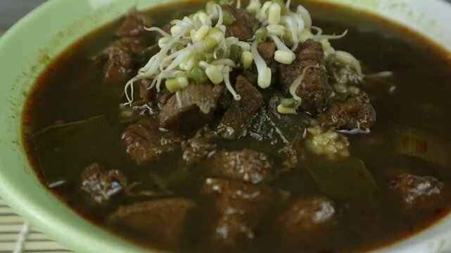 nasi rawon, Indonesian black beef soup with rice. Javanese food