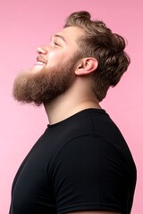 Fototapeta premium Trendy men's low fade haircut - midlife white man with blond hair. Artwork of style for aging men. A modern and happy gentleman enjoying his moment. Pink solid background.