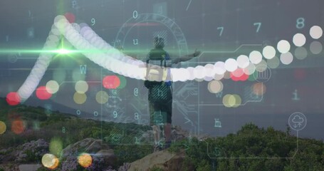 Male hiker exploring coastal trail, displaying floating tech icons showing cloud computing charts - Powered by Adobe