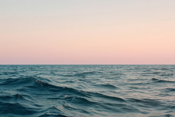 Obraz premium Serene Tranquility of Soft Waves and a Pastel Gradient Sky Over a Calm Sea at Dusk