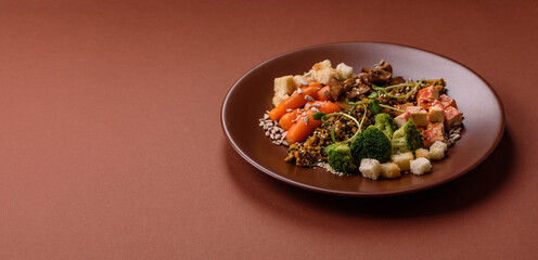 Food bowl with tofu, quinoa, broccoli and carrots, microgreens