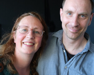 A Dutch couple poses in front of the camera. They differ in length and in age. He is 42. She is 36....