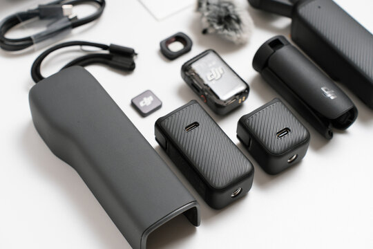 PENANG, MALAYSIA - OCT 15, 2024: DJI Osmo Pocket 3 unbox in isolated white background. Close up view of the Osmo Pocket 3 Battert Handle included in the creator combo set