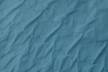 Abstract wrinkled blue crumpled paper texture background