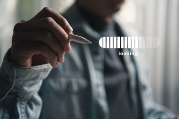 Hand holding a digital pen with a virtual loading bar on screen, representing technology, digital progress, user interface interaction, and modern innovation in a digital workspace