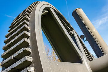 Detailed view of interlocking gears working together in a mechanical system during daylight