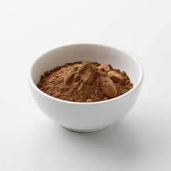 A white bowl filled with brown cocoa powder and small chunks on a white background studio shot