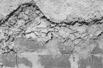 Repairing damaged wall outside with cement mortar messy strokes, abstract backdrop
