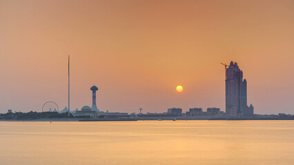 Naklejka premium Sunset in Abu Dhabi over Marina Island timelapse