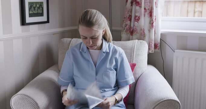 Thinking, reading and medical nurse with paper test results in nursing home or house for treatment or healthcare planning. Medicine worker, employee and research documents for life insurance