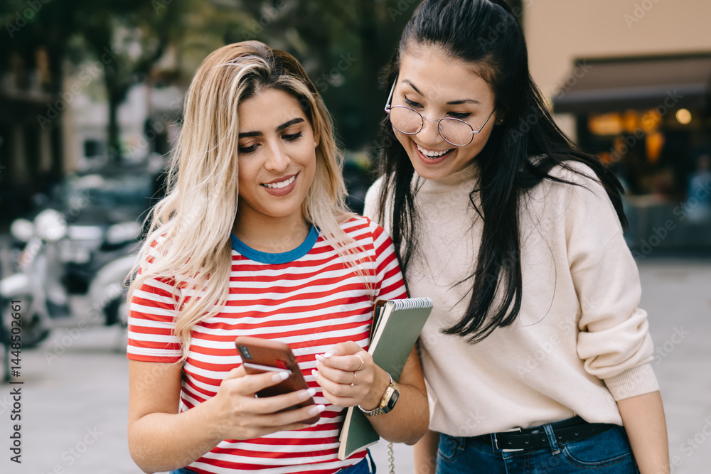 Aufkleber millennial hipster girls reading web news while tracking own location via modern cellular gadget, ch