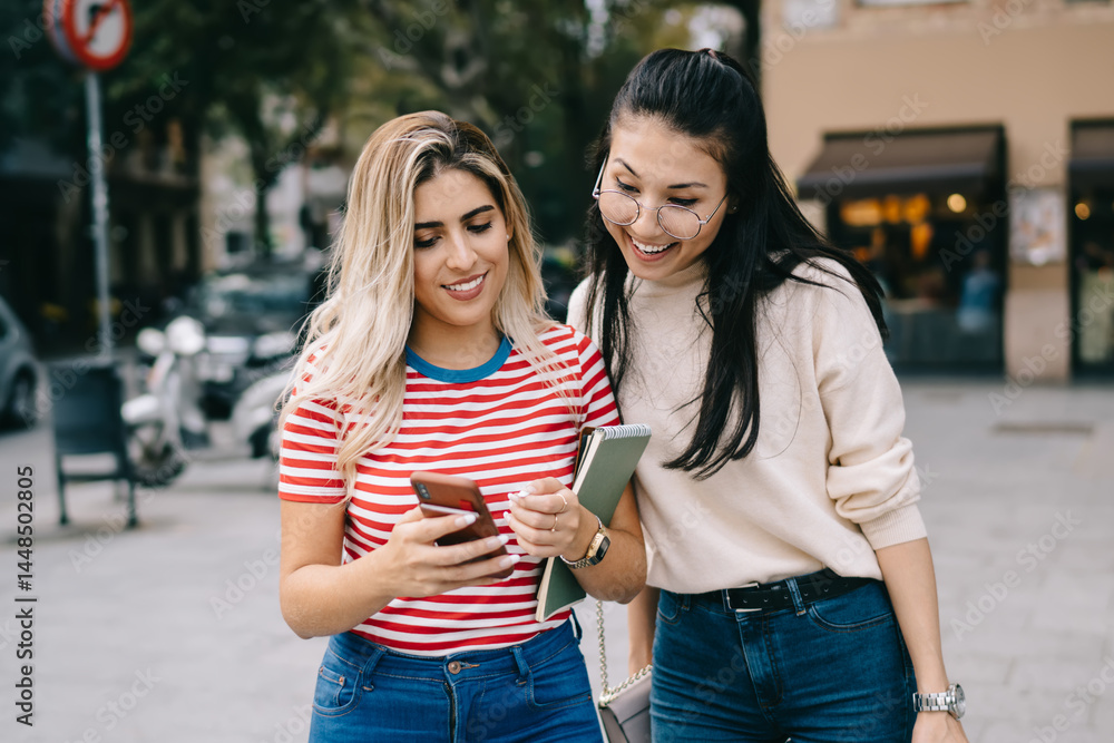 Aufkleber millennial hipster girls reading web news while tracking own location via modern cellular gadget, ch