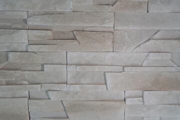 Natural stone imitation with a rough texture and muted palette. The irregular shapes and subtle...