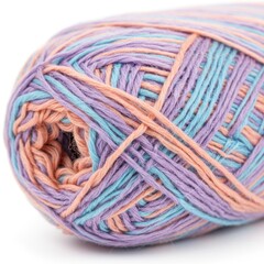 A close up of a ball of yarn with pastel colors of purple blue and peach on a white background