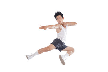portrait of muscular asian guy in sportswear high jump posing on white background