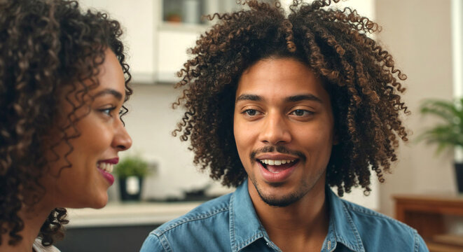 Engaged couple sharing a joyful conversation in a cozy kitchen  