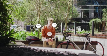 male student eating sandwich on outdoor bench, showing animated education chart and coffee cup icon - Powered by Adobe