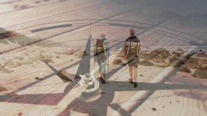 Two hikers walking across terrain, showing compass rose animation over planks for navigation tech - Powered by Adobe