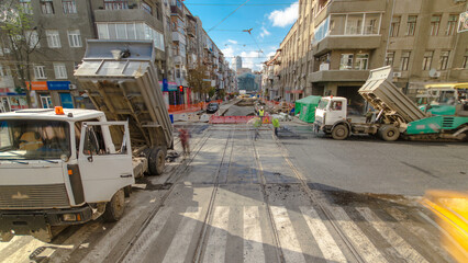 Tractor, roller on the road repair site timelapse. Road construction equipment.