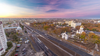 Aerial view with road traffic skyscape day to night timelapse. Kharkiv city from above