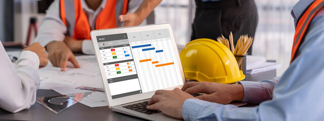 Project planning software for brisk business project management on the computer screen showing...