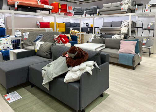 Vilnius, Lithuania - April 27, 2025: Modern Ikea showroom showcasing grey sofas and home accessories arranged in a cozy and functional setting