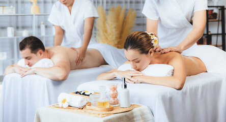 Caucasian couple customer enjoying relaxing anti-stress spa massage and pampering with beauty skin...