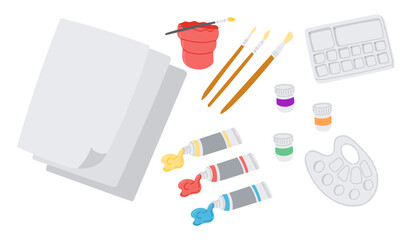 Set of painting and drawing supplies including brushes, palette, paper and paint tubes. Creative composition representing art process, inspiration and artistic expression