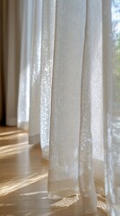 Soft, sheer curtains letting sunlight stream into a room