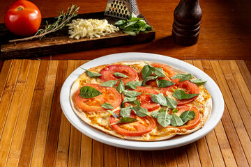 pizza with cheese and tomato