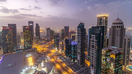 Fototapeta premium The skyline of the West Bay area from top in Doha day to night timelapse, Qatar.