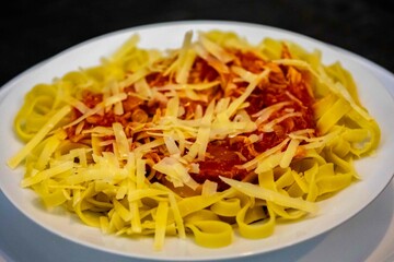 Authentic fettuccine or tagliatelle with tomato sauce and grated parmesan. real food