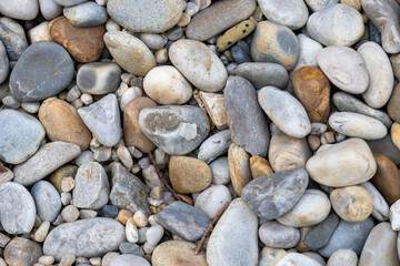Colorful pebbles forming a natural stone background texture