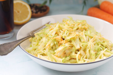 A bowl with coleslow salad	
