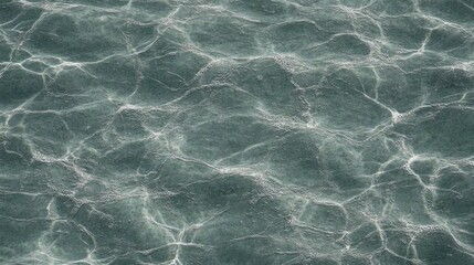 Rippled sea surface texture, reflecting light.