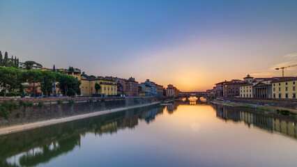 Sunset view of Florence Ponte Vecchio over Arno River in Florence timelapse, Italy.