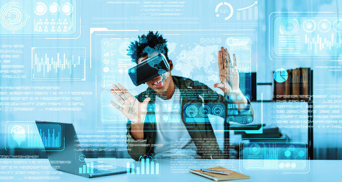 Businessman looking at financial statistic while wearing VR glasses. Manager checking and analyzing business data and financial chart while making decision by using artificial intelligence. Ingenuity.