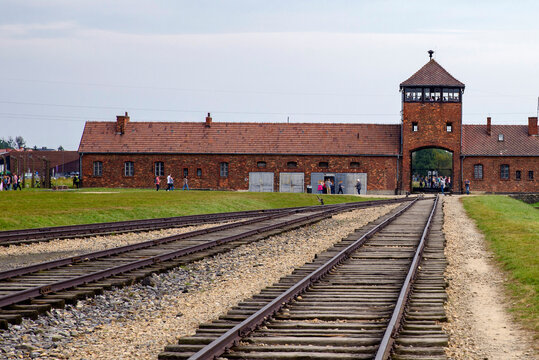 Railroad Track and the Gate of Death - Entrance of Auschwitz II - Birkenau, former German Nazi Concentration and Extermination Camp - Poland