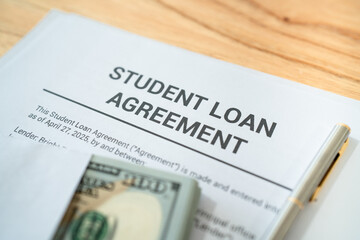 Student loan contract. Concept of taking on debt in order to pay for college.